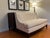 Offering the "Starlet" settee, designed by Barbara Barry for Henredon Furniture. Upholstered in cream fabric with a...