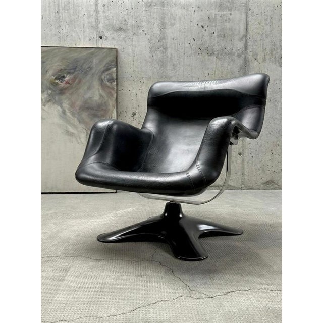 Perhaps one of the most fascinating and our favorite chairs is the "Karuselli" swivel chair with a lacquered fiberglass...