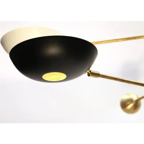 This unique compact brass chandelier has been expertly designed to work perfectly also with lower ceilings. With a 12-inch...