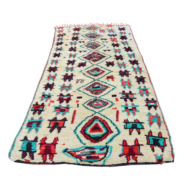 One-of-a-kind rug hand-knotted in the High Atlas Mountains of Morocco with soft organic wool. Featuring an ornate rhythmic...