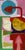 Bold arrow and disc shapes in red, pink, blue, mustard and green stack up the tall canvas, layered with collaged map-like...