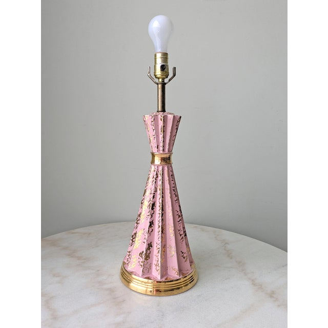 1950's Atomic Style pink and gold speckled ceramic table lamp. The lamp base measures 7.75" x 7.75"and the height to the...