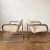Mid-century modernist accent or client arm chairs with tubular chrome frames and black molded plastic arms. Dated 1977,...