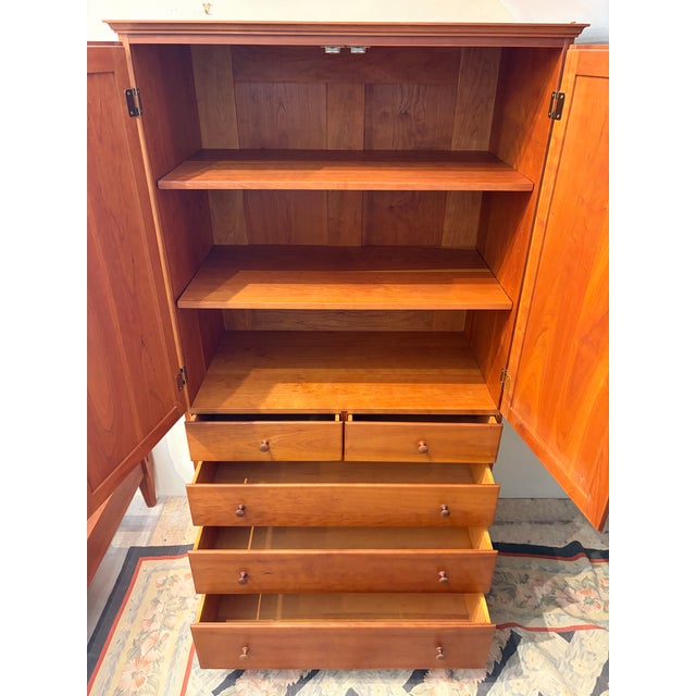 Up for sale in Sunapee Harbor is a shaker cherry linen press with 5 drawers below and cabinet doors on top. This is a...