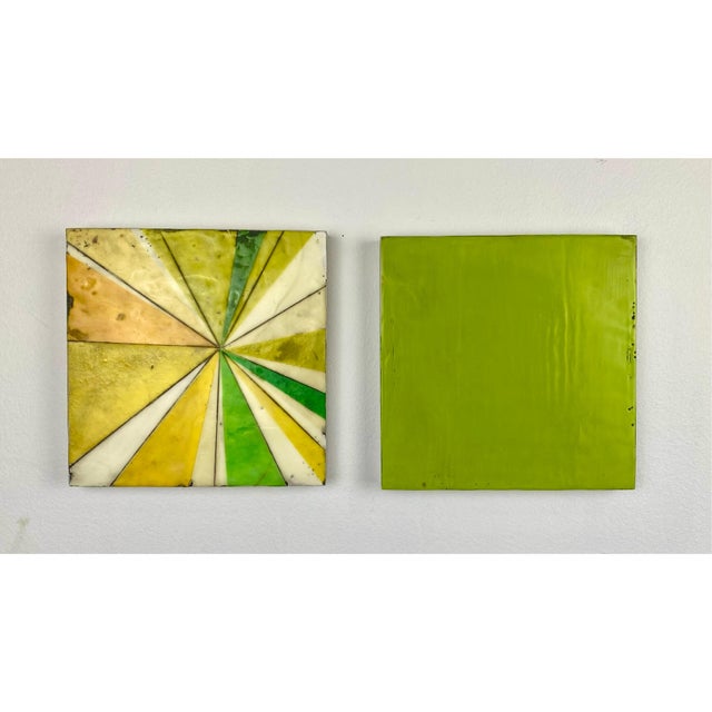Two 8”x8” cradled wood panels. Each shape is hand cut from natural fiber papers and then suspended between layers of clear...