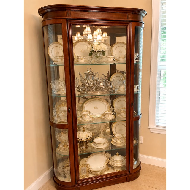Vintage Pulaski Furniture curved-glass curio display cabinet with a rich cherry or mahogany-tone finish. Beautiful vintage...