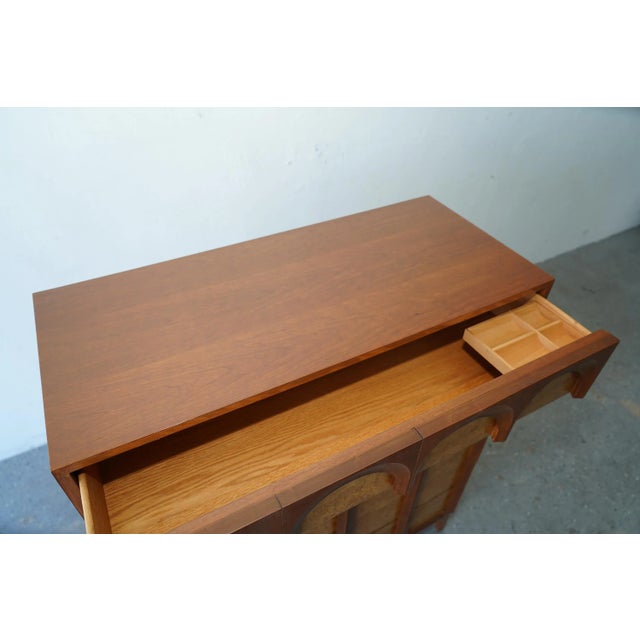 The 'Arched' series by Thomasville showcases exceptional hardwood construction, featuring exquisite burlwood veneer Has...