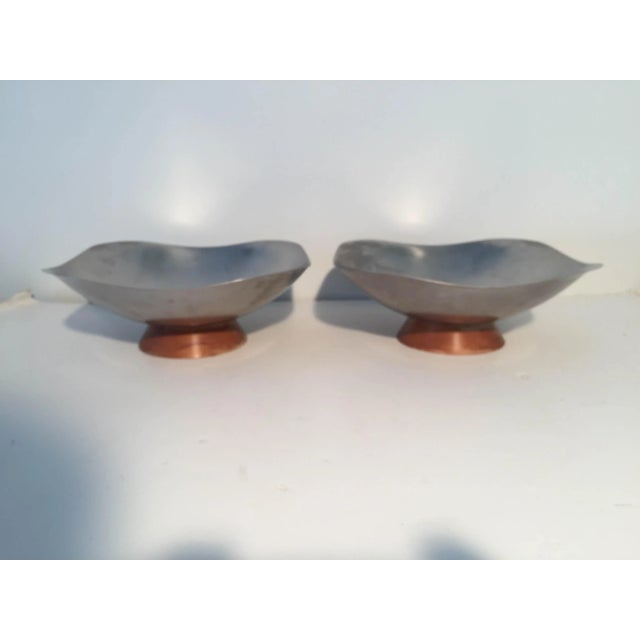 Midcentury modern set of two Serving Bowls, brushed stainless wood base. Makers mark reads "West Bend Stainless Steel Made...