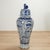 Impressive pair of palace size Chinese porcelain lidded urns with foo dog handles and hand decorated with aquatic scenes...