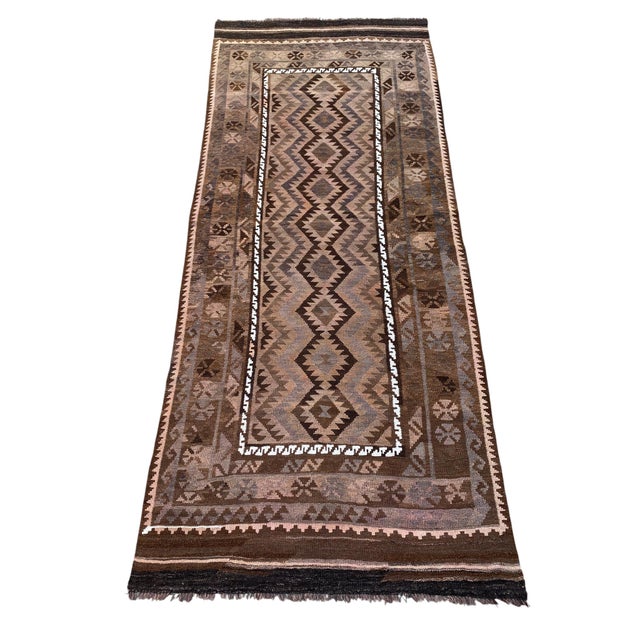 A handwoven Maimana kilim from northern Afghanistan, worked entirely in undyed sheep's wool. Maimana, in Faryab province,...