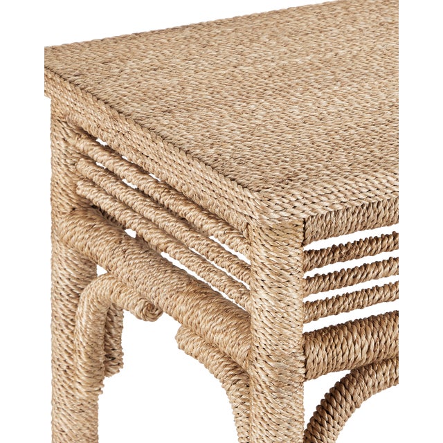 With the earthy feel of rattan and wicker, the Olisa Rope Console Table is covered in braided Abaca rope to bring a...