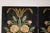 A black lacquer four-panel Chinese screen with majestic floral painted décor and crackle finish. Captivating our attention...