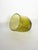 An elegant, Biot-style blown glass catchall, crafted from olive-green tinted glass and characterized by numerous air...