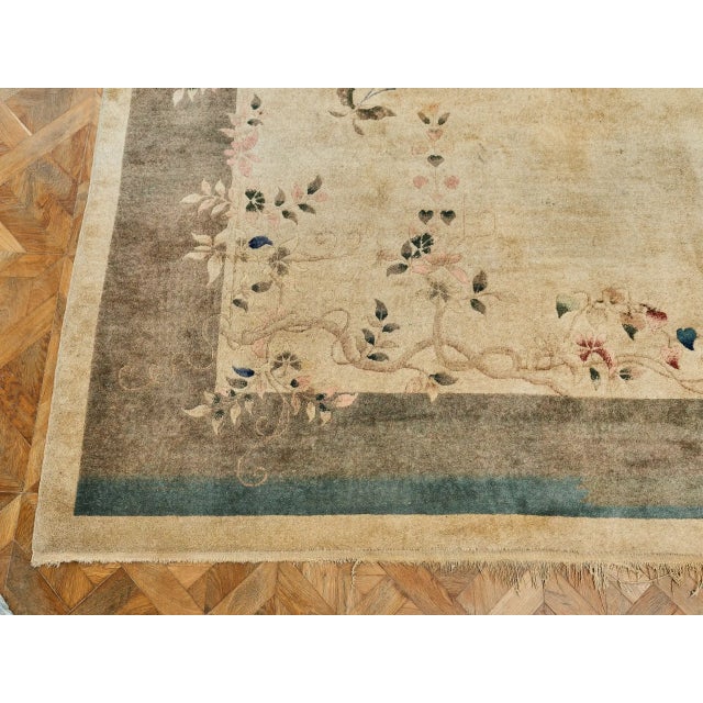 Elegant hand-knotted rug from China, Art Deco period (1920–1940). A typical feature is a delicate asymmetrical composition...
