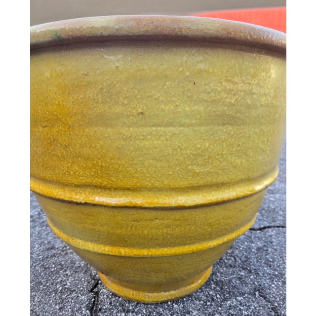 Add a touch of Mediterranean elegance to your home or garden with this handcrafted Moroccan pottery planter. Featuring a...