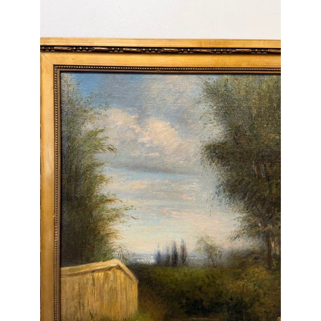 This 19th century French oil on canvas depicts a tranquil woodland scene with a road winding through tall trees, painting...