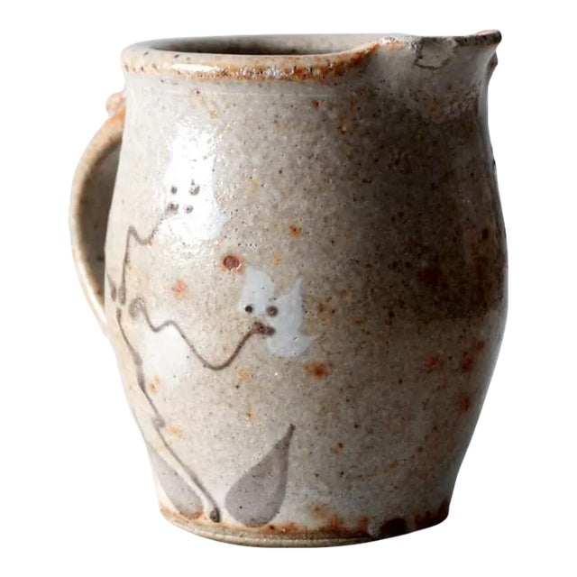 This charming vintage pitcher from Little Fort Pottery is a beautifully hand-crafted ewer featuring a warm speckled brown...