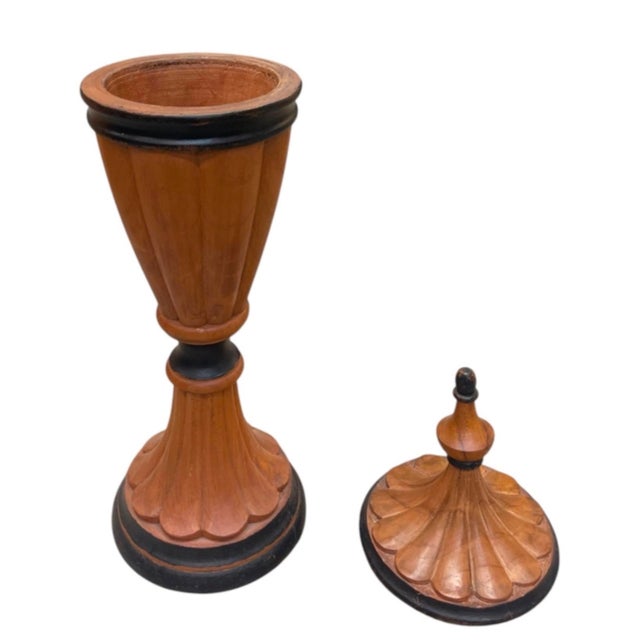 Elevate your home decor with this striking vintage decorative urn, expertly crafted from solid turned wood. Featuring an...