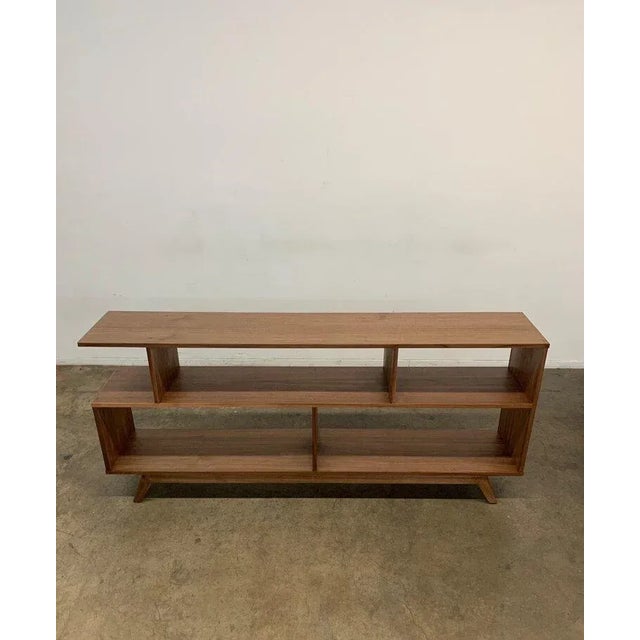 W72 D13 H22 Top Shelf: H10 Bottom Shelf: H13 Second version of our Handcrafted walnut veneer and solid walnut book case...