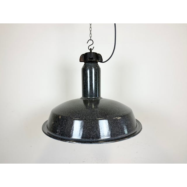 Industrial dark grey enamel pendant light made by Elektrosvit in former Czechoslovakia during the 1960s. White enamel...