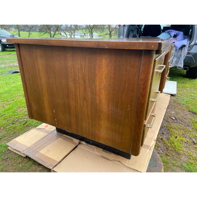Vintage mid century modern wooden tanker desk, top is Formica some scuffs and marks , has filling and dovetail drawer with...