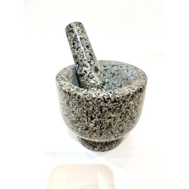 Dark grey and black granite mortar and pestle. Pestle is 5.5” long and is included.