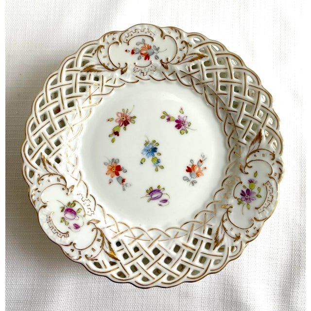 A beautiful set of 8 Meissen tea plates hand painted in the Richard Klemm Dresden studio. The reticulated borders feature...