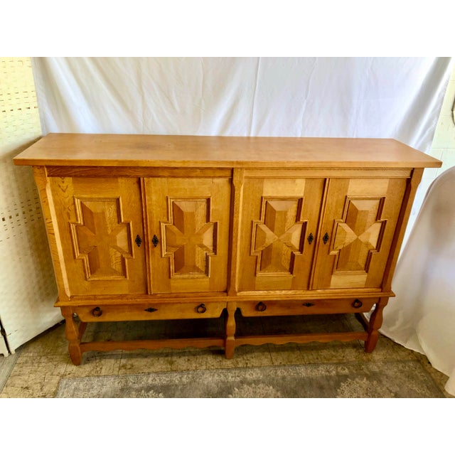 Solid oak sideboard designed with integrity and style. It’s also gorgeous to look at and has (4) carved cabinet doors with...