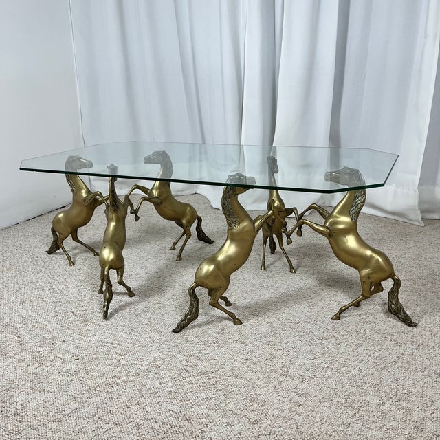 Hollywood Regency Style Coffee Table, 6 Patinated Brass Horses & Glass Top, 1970 A rare vintage coffee table from the...