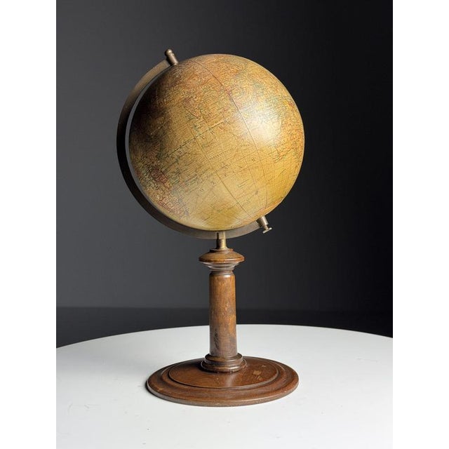 A nice little globe. from the mid-20th century. Made by Kartogr. Institut D. Reimer Berlin. Dimensions: 38h x 22d x 21w cm