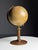 A nice little globe. from the mid-20th century. Made by Kartogr. Institut D. Reimer Berlin. Dimensions: 38h x 22d x 21w cm