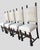 A set of 4 Tudor Revival Dining Chairs. Crinoline style stretchers. Heavily carved front cross-rail with a center "Tudor...