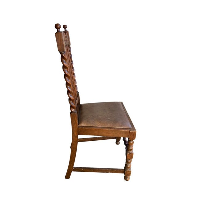 Pair of antique oak barley twist dining chairs dating from the late victorian (c. 1880) edwardian (c. 1910–1920) eras....