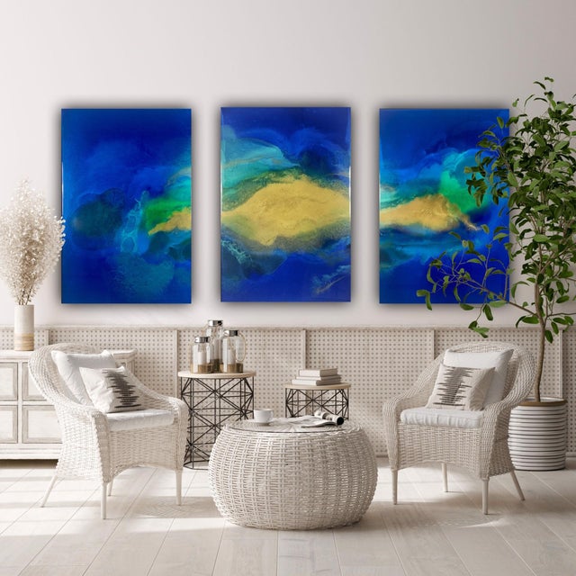 This triptych presents a vibrant interplay of deep blues, lush greens, and warm golds, creating an immersive underwater...
