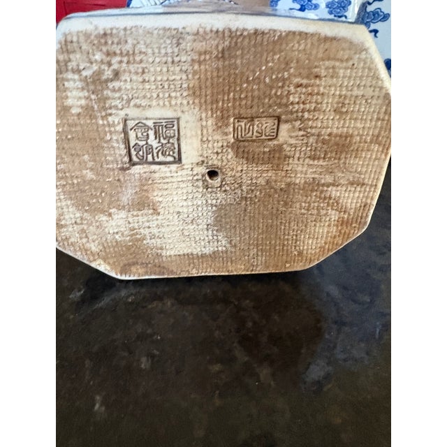 Three Chinese porcelain figurines representing generations of Qing Dynasty emperors. Material: Hand-painted blue and white...