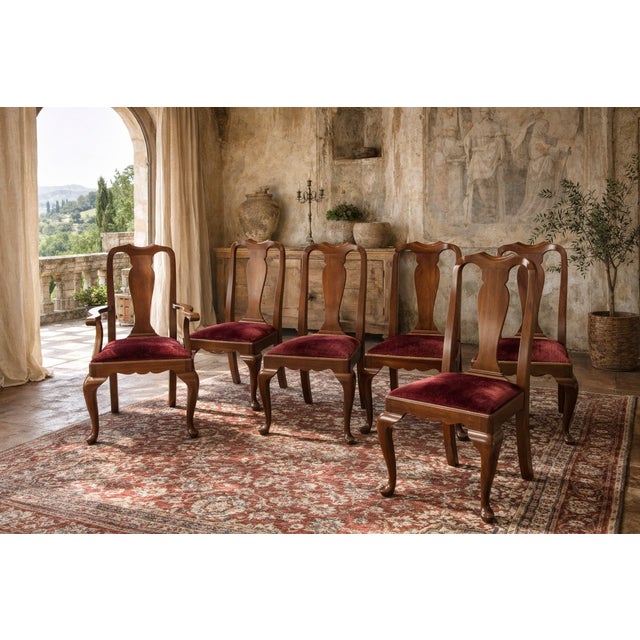 An exceptional set of eight solid wild black cherry dining chairs by the renowned Henkel Harris, produced during their...