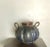 Beautiful blue and brown studio vase with two handles. Artist signed on bottom. Excellent condition B19