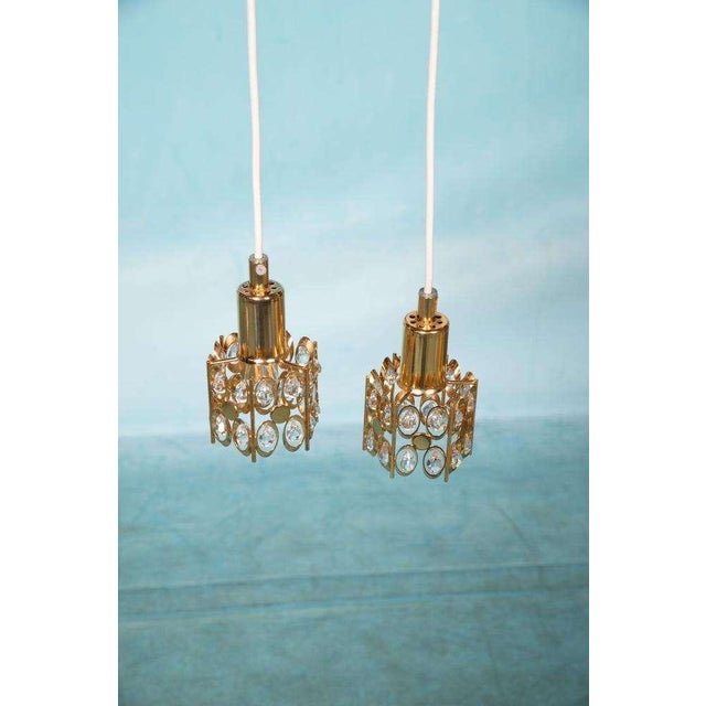 Sweet compact hanging lamp made by Palwa in the sixties. A chic piece of jewelry that can be combined with many interior...