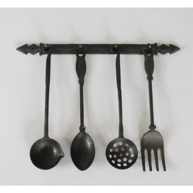 1960's hand forged cast iron utensil wall hanging set. Made in Taiwan. Some minor age wear. Each piece is marked Taiwan....