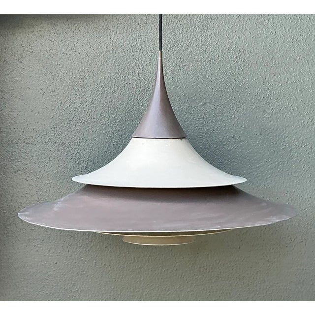 Showcasing quintessential Nordic mid-century functionalism, this vintage Scandinavian pendant light features a multi-...