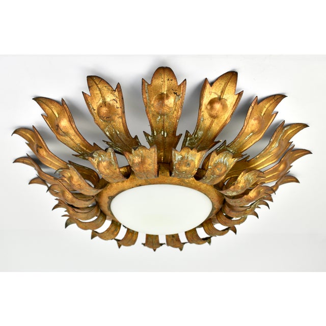 Beautiful 1950s gilded iron flush mount, made in Spain. The gilded metal has a stunning green patina, rare find in this...