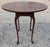 This Baker Furniture Solid Mahogany Pembroke Table is a masterclass in traditional American cabinetry, offering both...