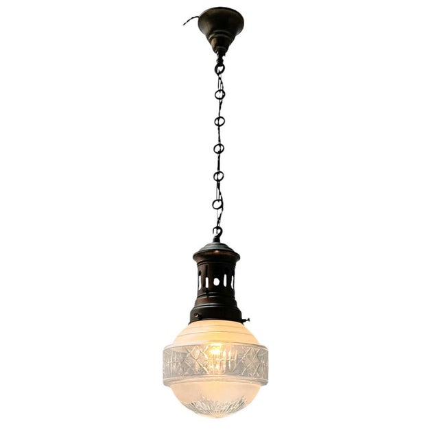 Stunning and elegant Art Nouveau pendant lamp. Striking French design from the 1900s. Original patinated brass ceiling...