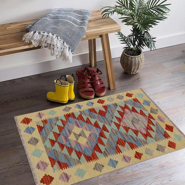 Elevate the elegance of your home with this stunning hand-woven tribal Kilim wool rug. Meticulously crafted on a loom by...