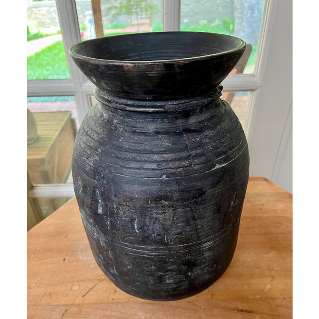 Imported from the Netherlands. Hand carved wood pot originally created for food storage. Unique design and naturally aged...