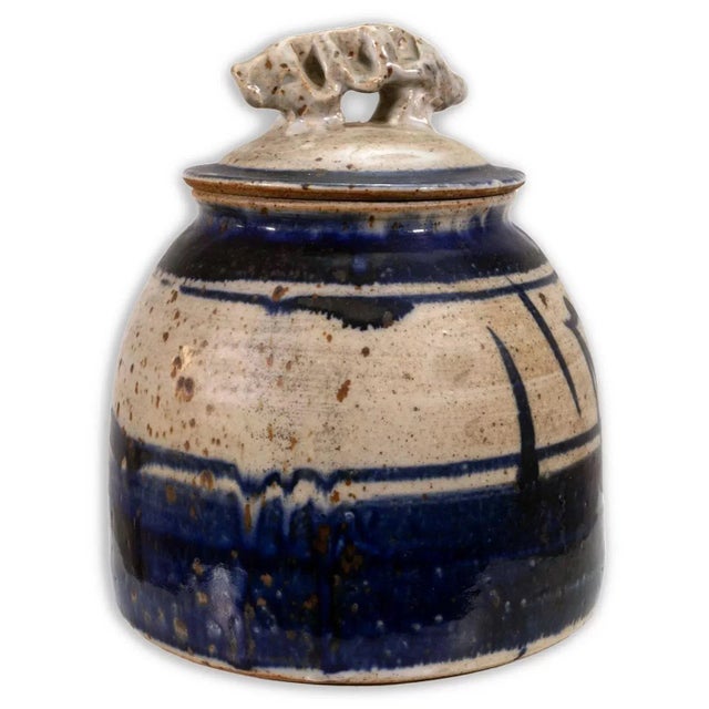 A modernist stoneware glazed ceramic covered vessel by Detroit artist John Glick of Plum Tree Pottery. Circa late 20th...