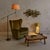 A 1950s Italian lounge chair, reupholstered in rich, forest green velvet with a luxurious sheen and softness. The clean,...