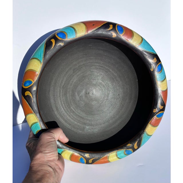 This beautiful Gouda Ceramic Bowl of hand painted designs and matte black glaze, from the Plateelbakkerij Zuid-Holland...
