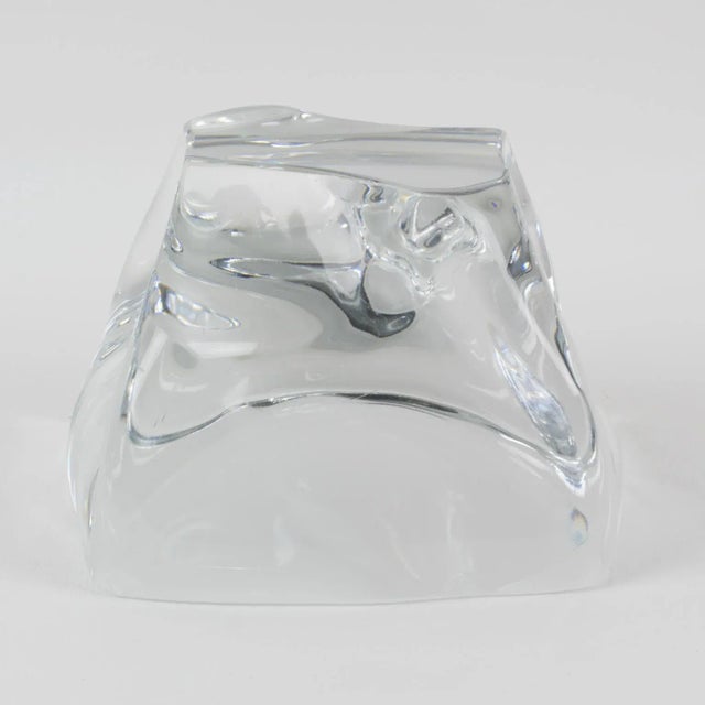 Stunning crystal swirl freeform paperweight by Daum, France. French design of the 1950s with a mouth-blown clear crystal...