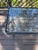 A vintage American indoor/outdoor glass top console table with branching tree limb motif, like the ones seen in last...